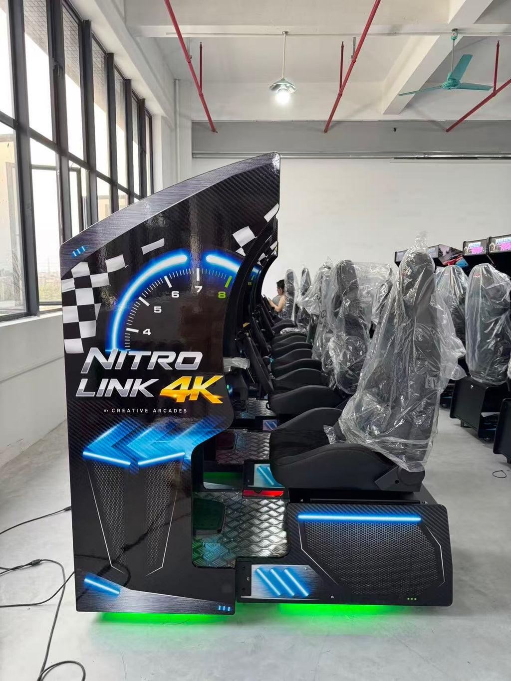 Nitro Link 4K™ Set of 2, 4, or 6 Sit Down Racing Simulator Arcade Machines with Neon Cabinet Lights and 236 Games